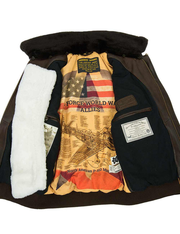 Men's brown leather jacket unbuttoned with additional fur collar, bright lining and internal pockets are visible.