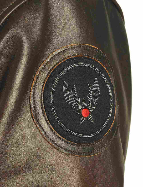 Round patch on the sleeve of a men's brown leather jacket.