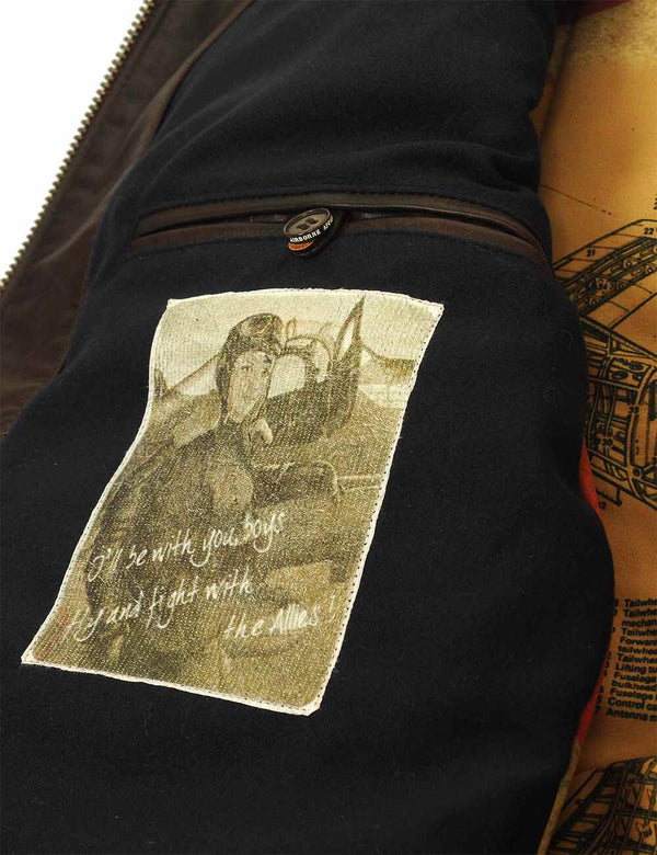 A patch and an inside pocket of the men's brown leather jacket.
