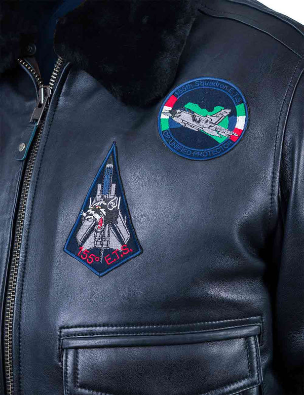 Fighter jet patches on the left chest of the dark blue leather jacket.