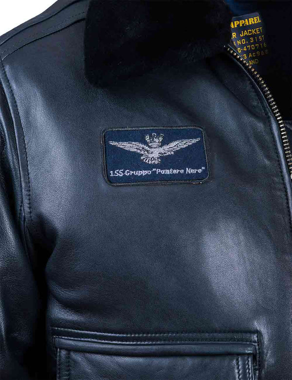 A patch with an image of an eagle on the chest of a dark blue leather jacket.