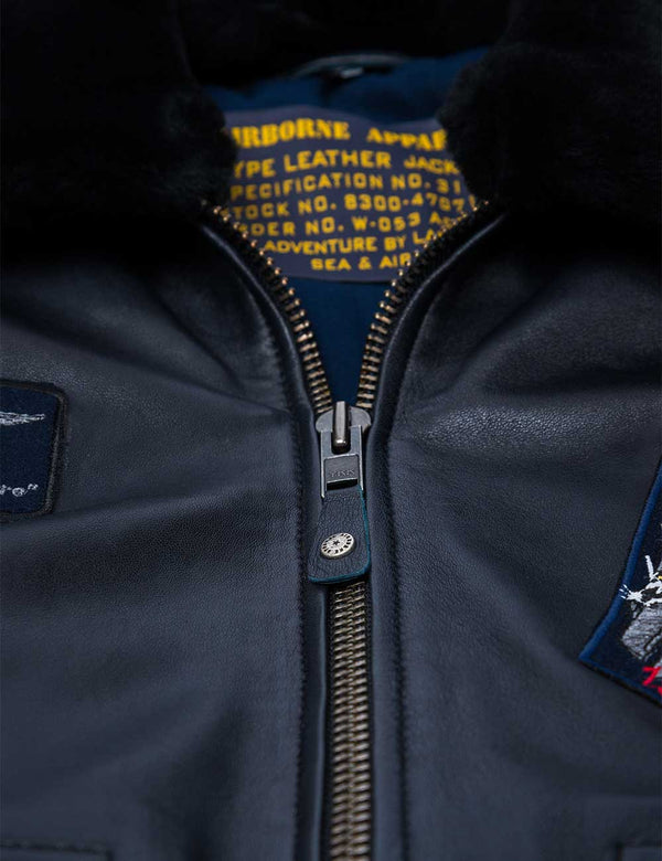 Iron zipper on a blue leather jacket.
