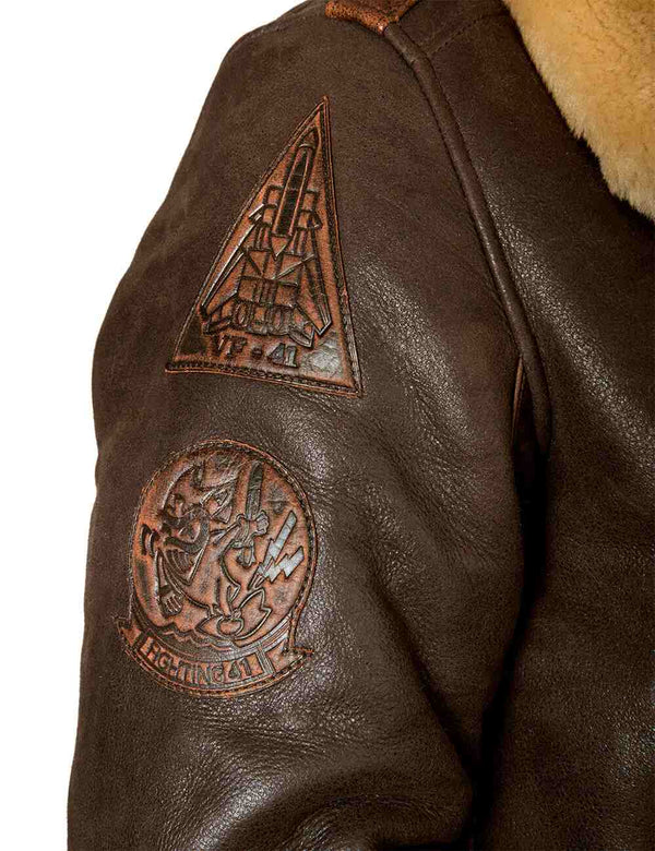 Patches on the sleeve of a brown sheepskin jacket.
