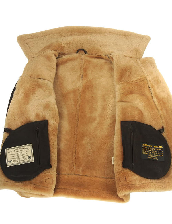 Men's brown sheepskin coat unbuttoned, revealing beige fur.