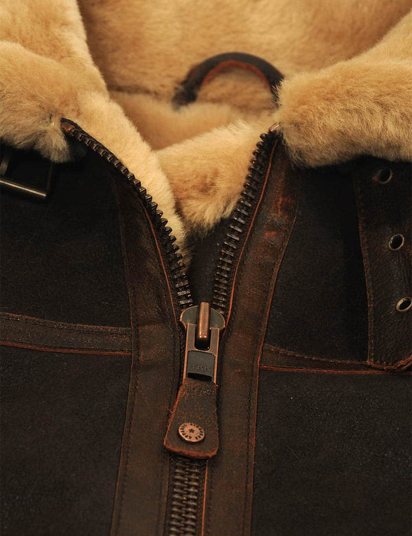Metal zipper on a men's brown sheepskin coat.