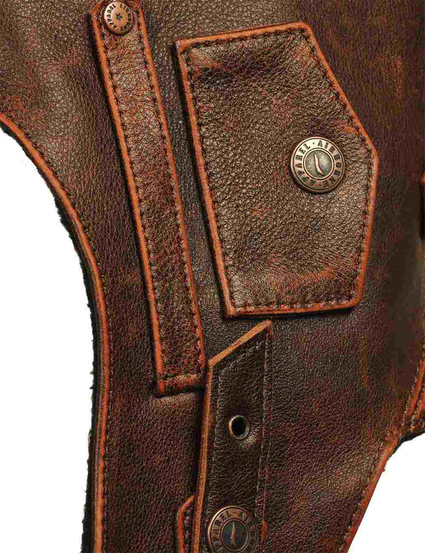 Detail on a brown leather men's helmet.