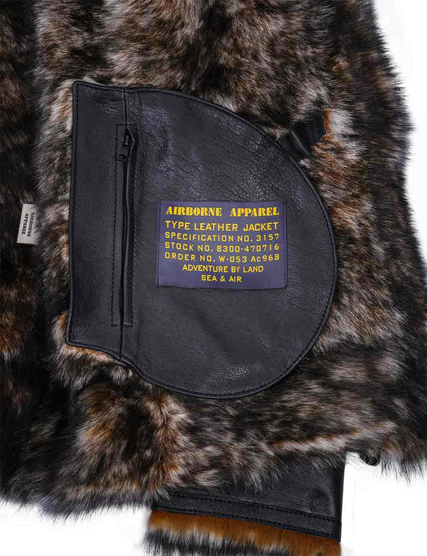 The inner fur part of a black leather jacket with a label on the inner pocket.