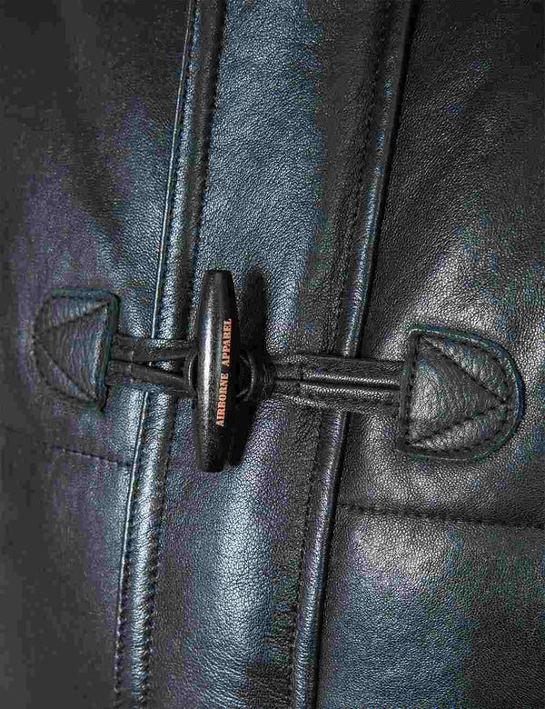 Button of a men's leather down jacket.