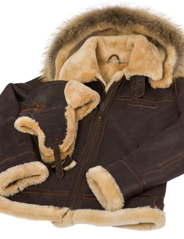 Brown sheepskin jacket with hood and a brown fur hat.