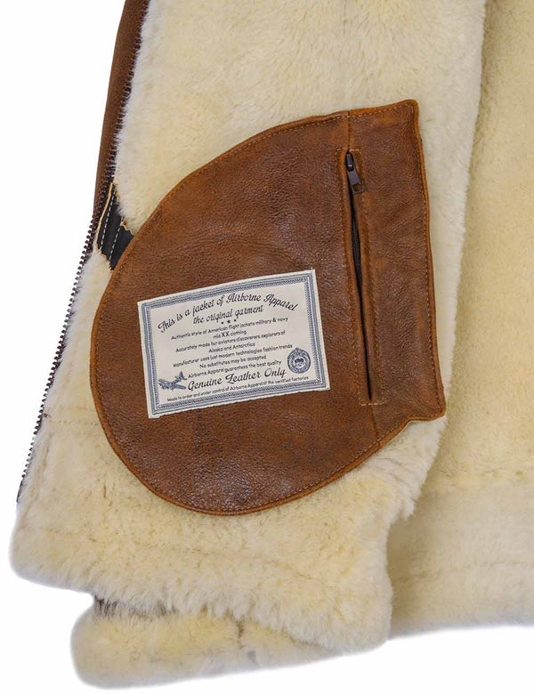 Internal pocket of the sheepskin jacket, with a zipper and a patch.