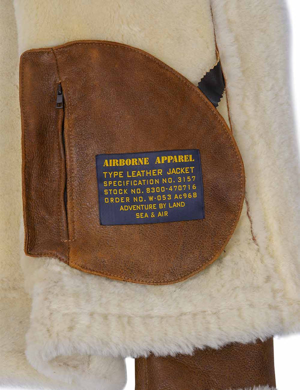 Internal pocket of the sheepskin jacket, with a zipper and a patch.