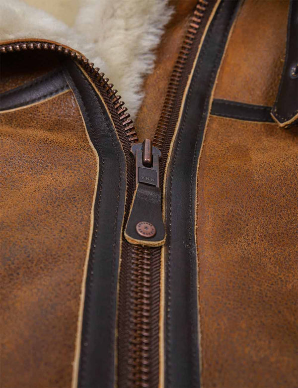 Metal zipper on a men's shearling jacket.