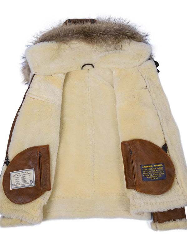 Inner light fur of a sheepskin jacket with a hood trimmed with raccoon fur, inside.