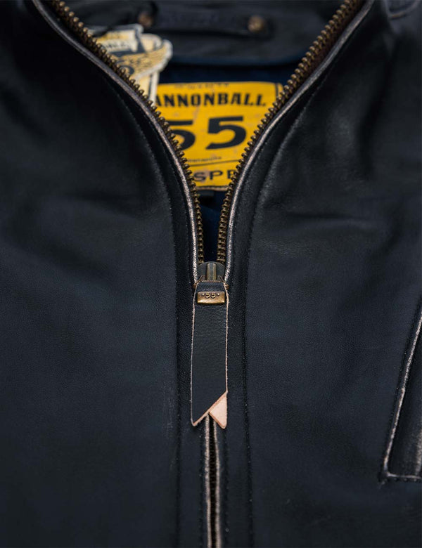 Metal zipper on a men's black leather jacket.