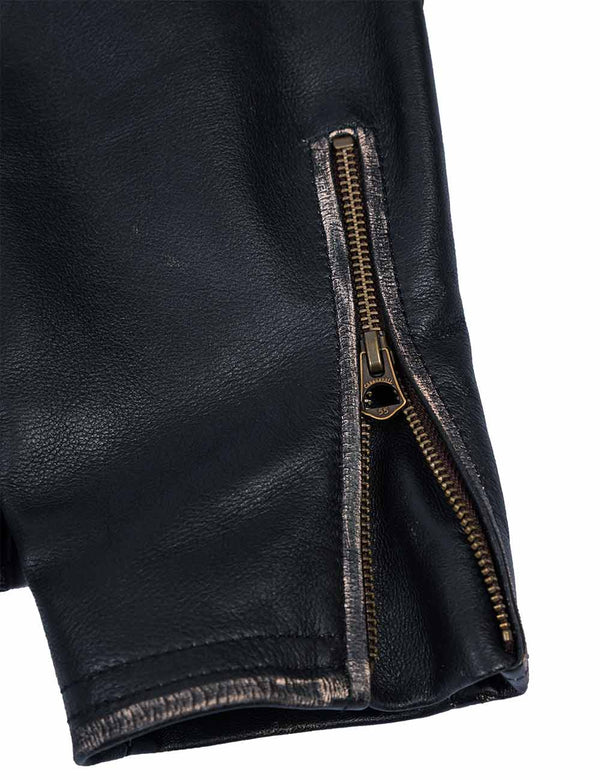 Metal zipper on the sleeve of a men's black leather jacket.