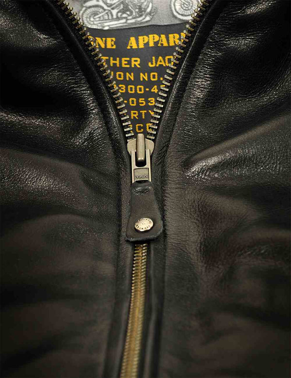 Metal zipper on a black leather jacket.