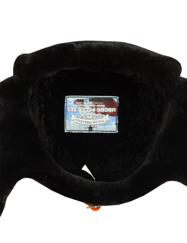 Bright patch inside the sheepskin trapper hat.