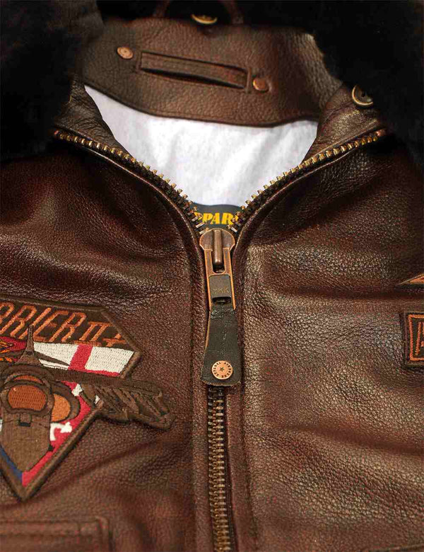 Metal zipper of a brown men's leather jacket.