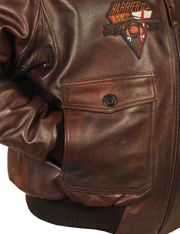 Pocket and part of the sleeve of a brown men's leather jacket.