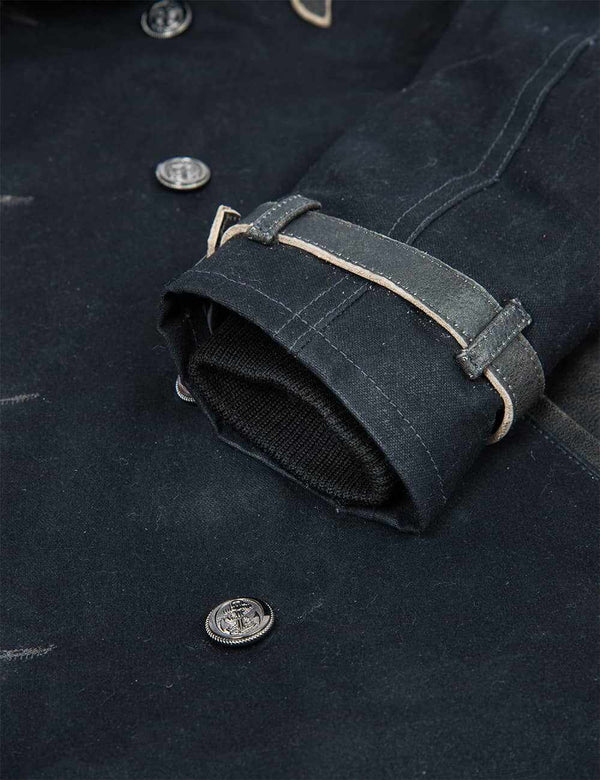 Sleeve of a men's black pea coat.
