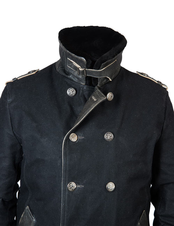 Part of a men's black pea coat.