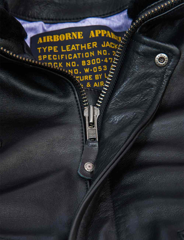Metal zipper of black men's leather jacket.