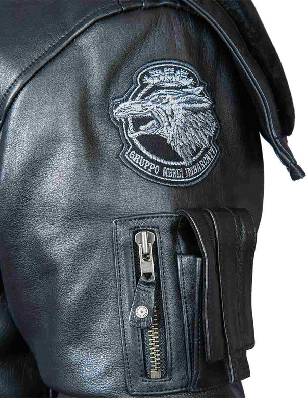 Utility pocket and patch on the sleeve of a black men's leather jacket.