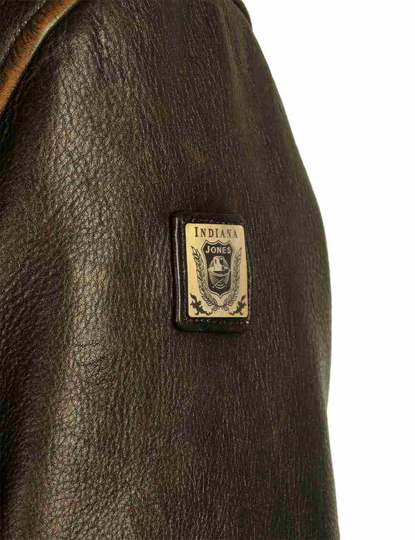 Small patch on the sleeve of a men's brown leather jacket.