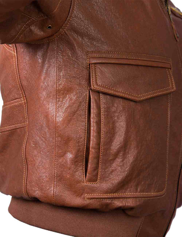 Underarm area of a men's brown leather jacket.