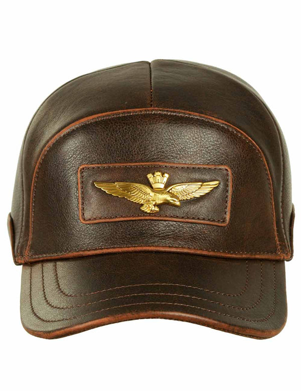 Brown leather men's cap with gold metal eagle emblem on forehead, front view.