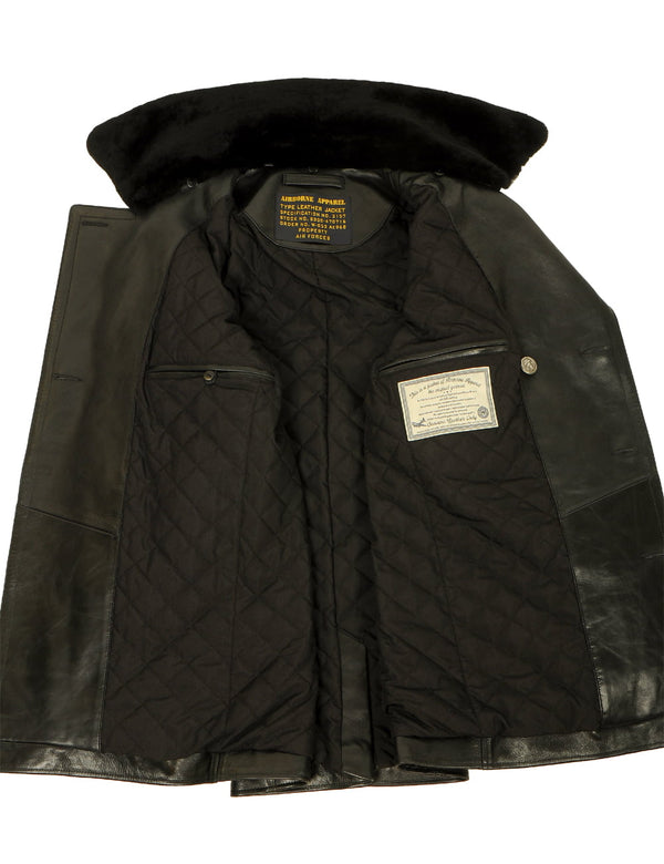 Men's black leather pea coat with a fur collar, unbuttoned, showing the lining and inner pockets.
