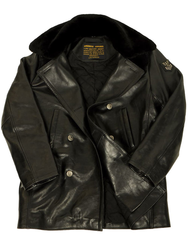 Men's black leather pea coat with a fur collar, unbuttoned.