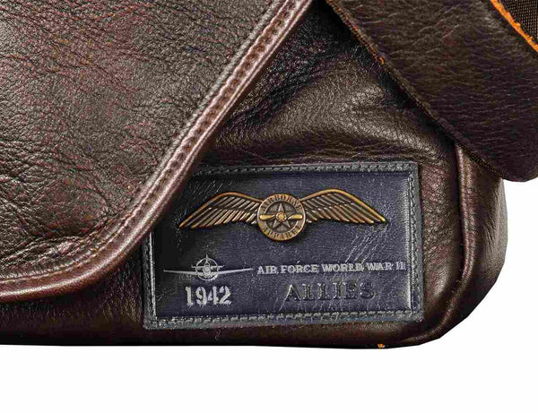 Patch on a brown men's leather bag.