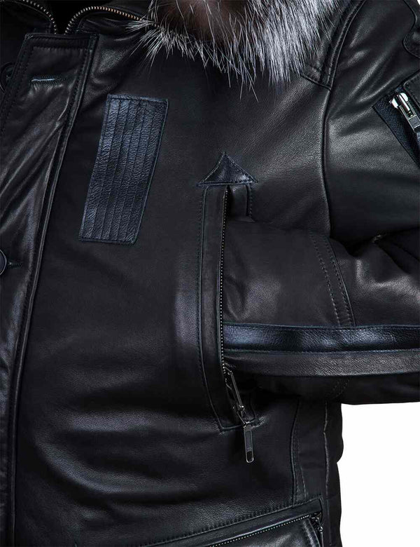 Left side of a black leather jacket with a hood, sleeve in the top pocket.