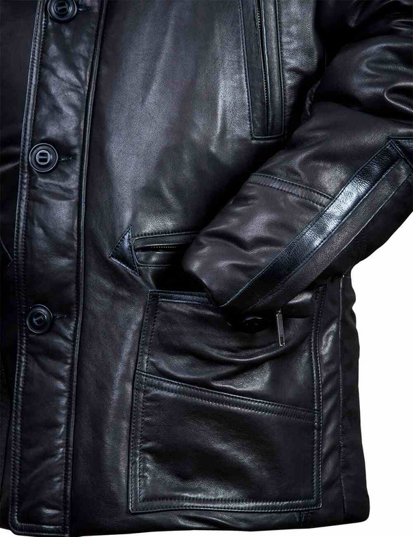 Left side of a black leather jacket with hood, the  sleeve in the lower pocket.