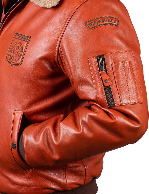 Left side with sleeve in pocket of orange leather jacket.