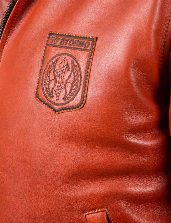 Patch on the chest of a men's orange leather jacket.