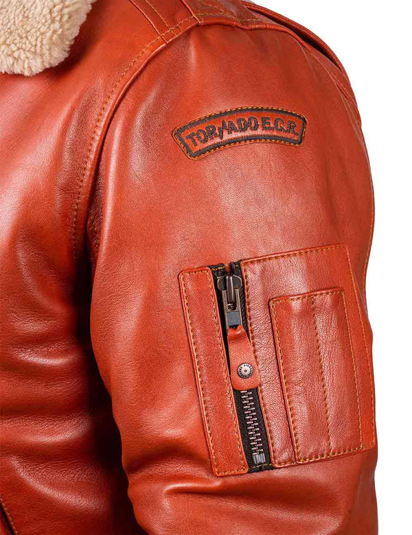 Utility pocket on the left sleeve of a men's orange leather jacket.