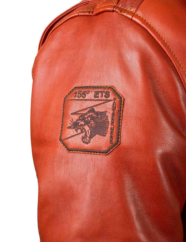 A panther patch on the right sleeve of an orange leather jacket