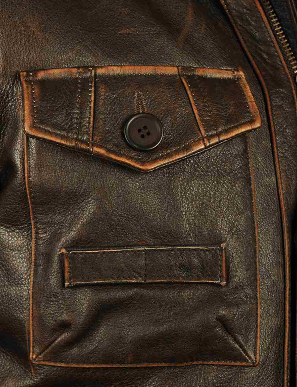 Pocket of a brown men's leather jacket.
