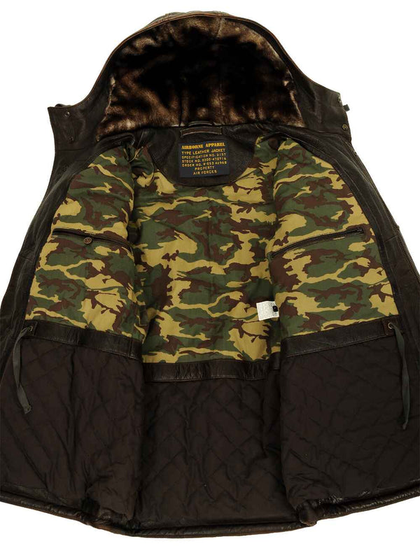 Men's long brown leather jacket with a fur-lined hood, unbuttoned, showing the lining and inner pockets.