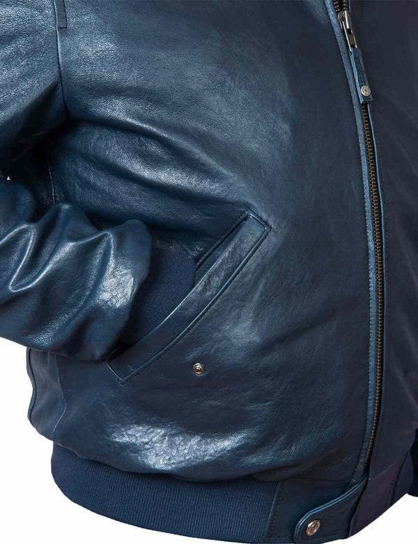 The right side of a men's leather navy blue jacket, the sleeve is in the pocket.