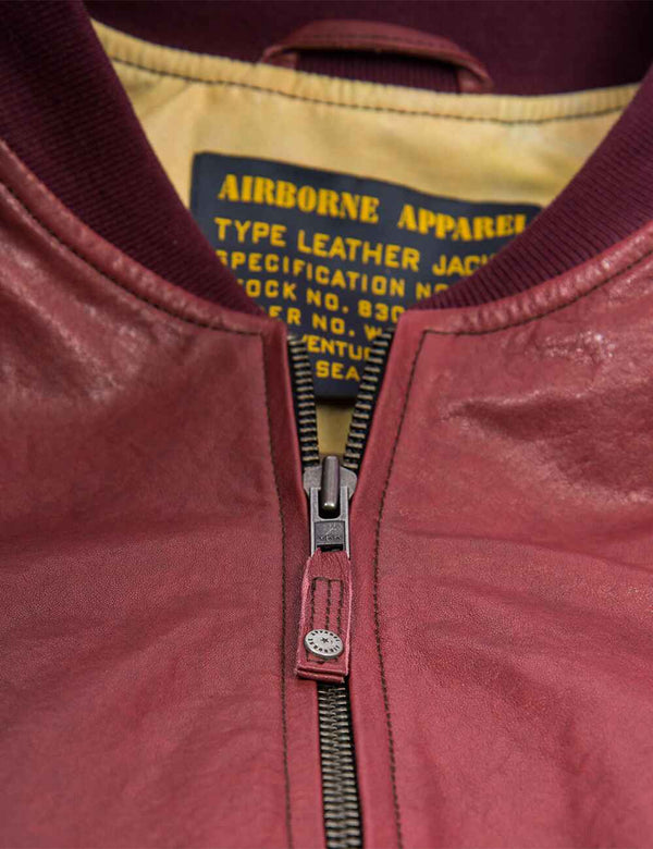 Metal zipper on a bordo men's leather jacket.