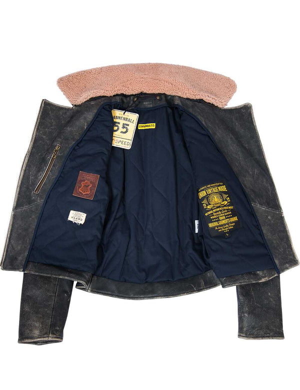 Black women's leather jacket with bleached seams and unbuttoned fur collar, revealing dark blue lining with patches.