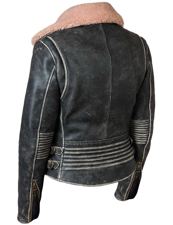 Black women's leather biker jacket with bleached seams and a fur collar, back view.