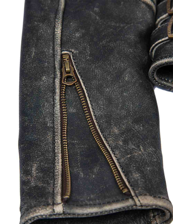 Metal zipper on the sleeve of a black women's leather jacket with bleached seams.