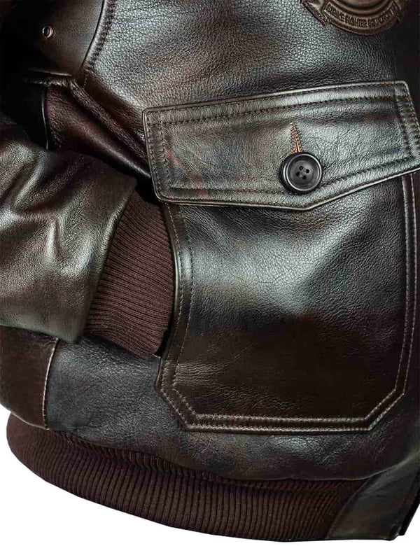 A pocket of a men's brown leather jacket, the sleeve is in the pocket.