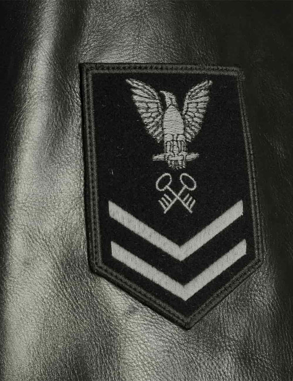 Patch on the sleeve of a men's black leather pea coat.