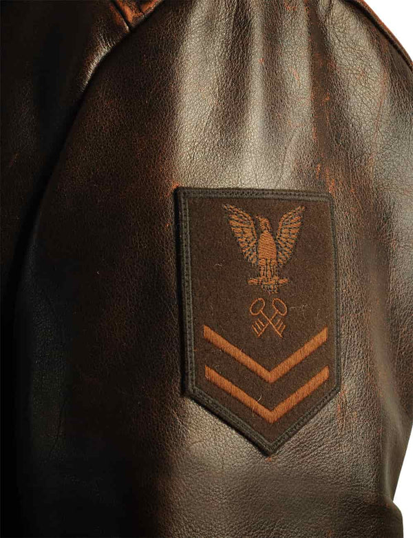 Patch on the sleeve of a men's brown leather pea coat.