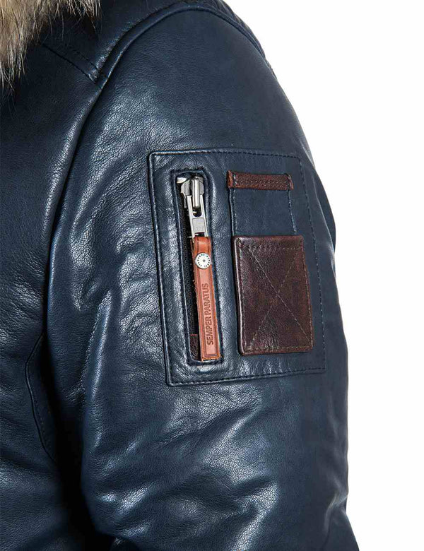 Utility pocket on the sleeve of a men's blue leather parka.